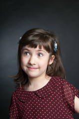 Beautiful young girl on black background