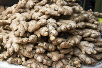 Fresh juicy ginger on a counter in the market of India of Goa