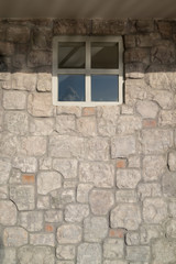 Stone veneer wall with window