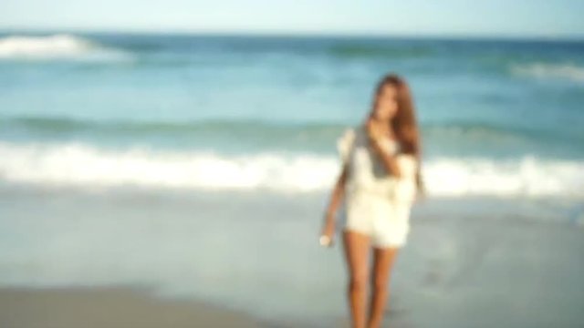 Beautiful young Brazilian woman smiles on a beach in Brazil