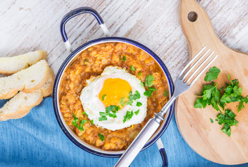 Fried egg with cooked lentils