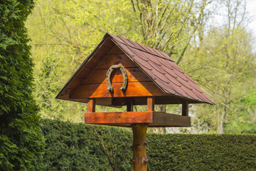 Birdhouse with horseshoe