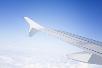 Clouds and sky as seen through window of an aircraft