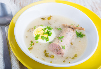 Borscht with eggs and white sausage. (Polish easter soup)