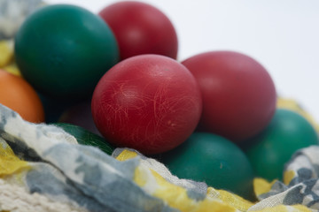 Fototapeta na wymiar Easter eggs are folded into the fabric