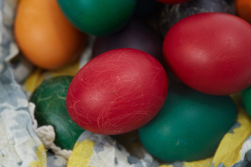 Fototapeta na wymiar Easter eggs are folded into the fabric