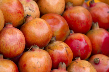 Fototapeta na wymiar Fresh juicy pomegranate on a counter in the market of India of Goa