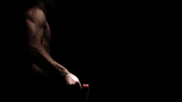 Male athlete jump ropes. Medium shot.
