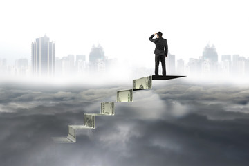 Fototapeta na wymiar Man on top of money stairs looking at cityscape cloudscape