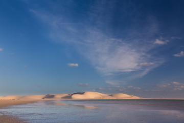 Glorious sand dune in the distance over empty tidal lagoon