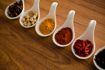 Wooden table of colorful spices