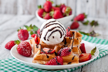 Belgium waffles with strawberries and ice cream 