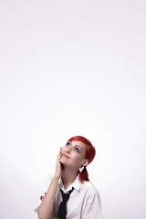 Beautiful girl on a white background looking up