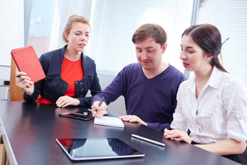 Three businessmen discussing something together