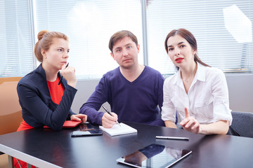 Three businessmen discussing something together