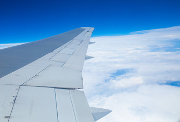 Fototapeta na wymiar Wing aircraft in altitude during flight
