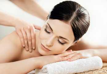 Young and beautiful woman on a massage therapy