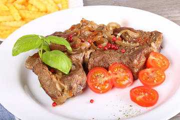 Big piece of beef with tomato
