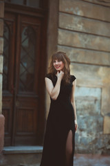 Young beautiful woman visiting a city center during a sunny day,