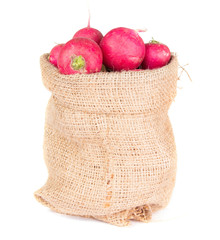 radish in a burlap bag isolated on white background