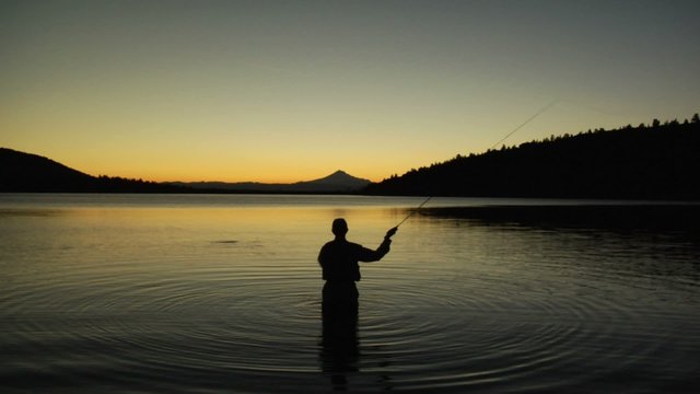 Fly-Fishing at a mountain lake.