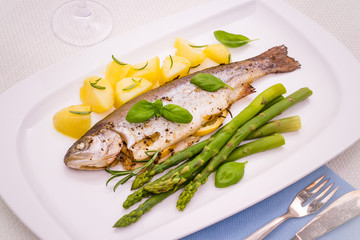 Grilled trout with rosemary potatoes and green asparagus