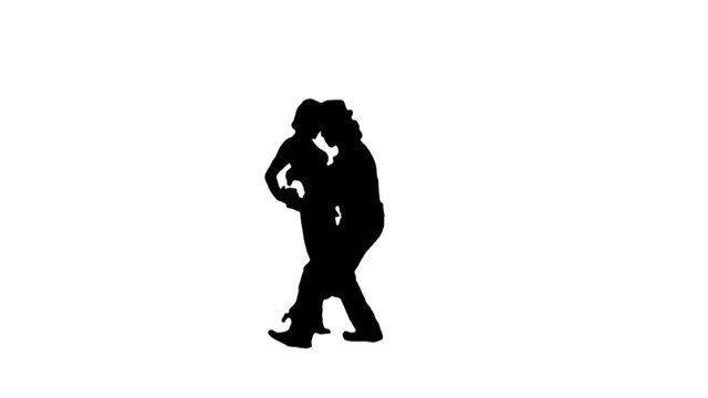 A salsa dancing couple silhouetted on blue dance energetically