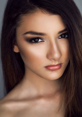 Fototapeta premium Portrait of young beautiful woman with perfect clean skin 