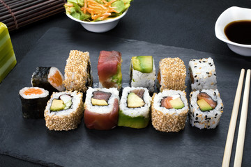 sushi rolls / sushi menu assorted on the table restaurant