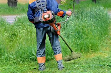 Man mows grass