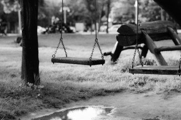 Child swing. Made from wood, hanging on chains