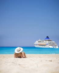 Fototapeta na wymiar Woman relaxing on the famous Shipwreck beach in Zakynthos