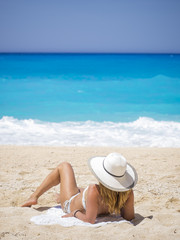 Fototapeta na wymiar Woman relaxing on the famous Shipwreck beach in Zakynthos
