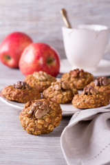 Oatmeal cookies with walnuts, apples and a cup of tea 