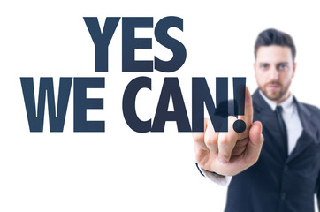 Business man pointing the text: Yes We Can!