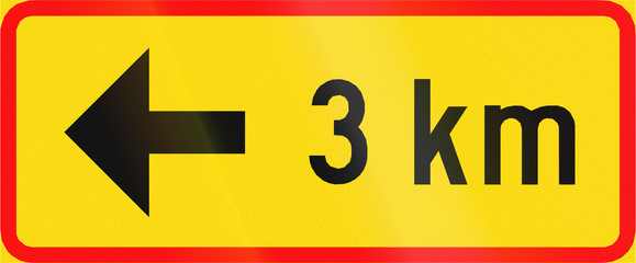 Additional traffic sign in Finland: Arrow to the left with distance