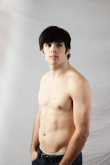 Fototapeta premium Shirtless man looking thoughtful