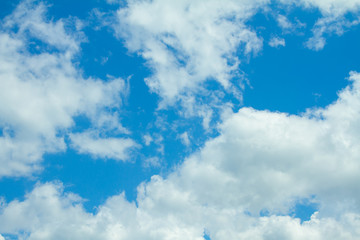Obraz premium white fluffy clouds in the blue sky