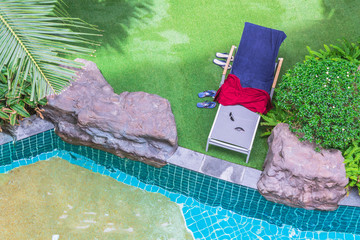 Relaxing poolside swimming pool chair.