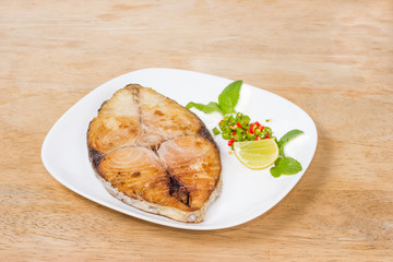spanish mackerel steak on wood background,fried fish