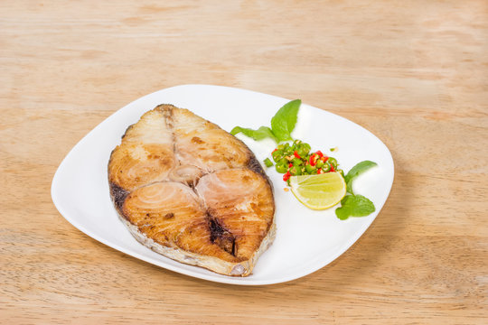 spanish mackerel steak on wood background,fried fish