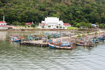 Fototapeta na wymiar Fishing boat with temple in Thailand