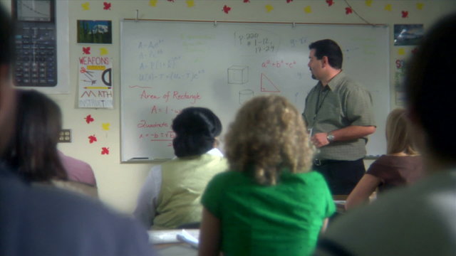 High School Teacher in Front of Class