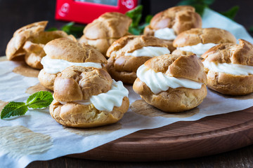 Profiteroles with cream, French dessert