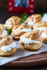 Profiteroles with cream, French dessert
