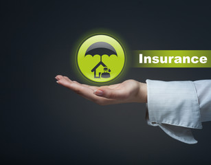 business, insurance concept. man holding a symbol of real estate
