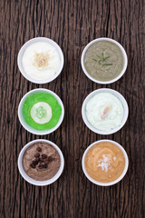 homemade body scrubs on wood background