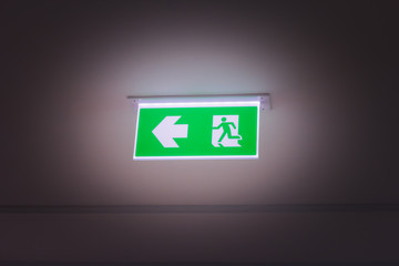 green fire exit light sign