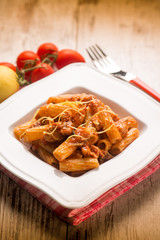 spaghetti with swordfish ragout and lemon peel, selective focus