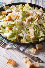 Classic Caesar Salad close-up, vertical

